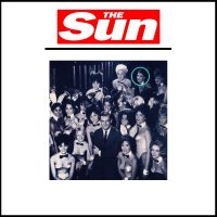 A group of people in front of the sun magazine cover.